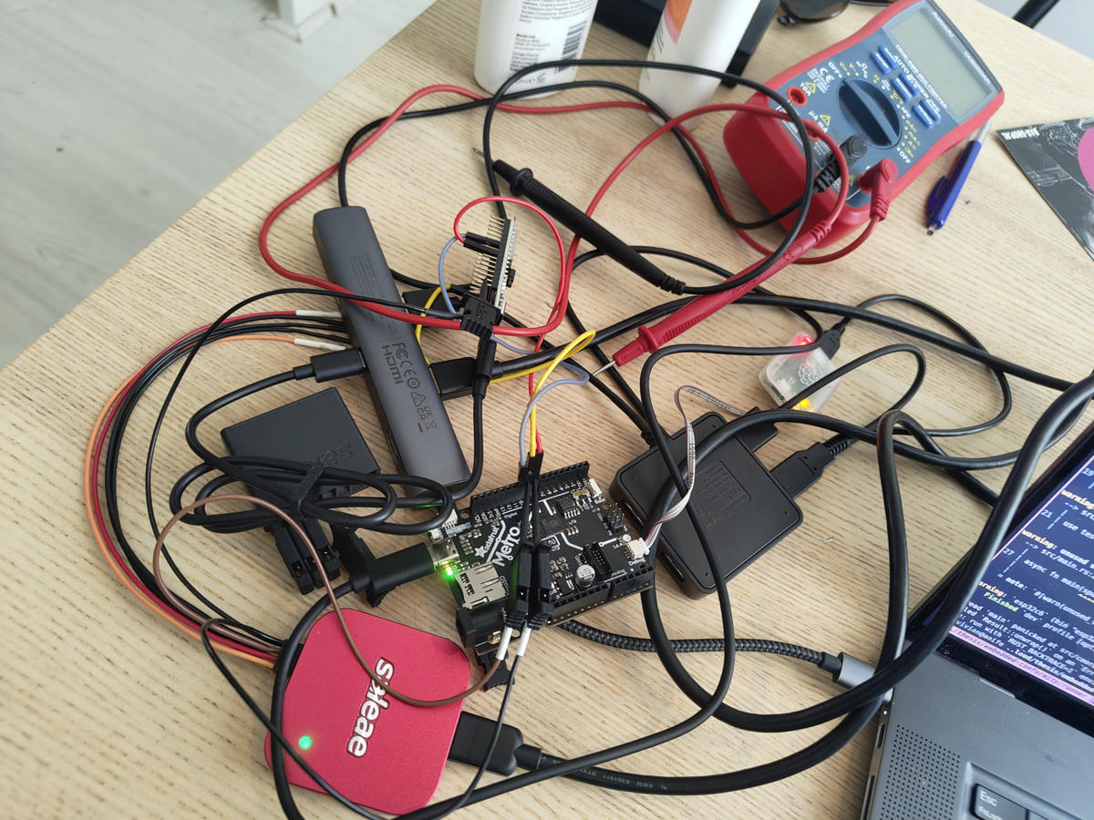 A collection of PCBs connected by reg, yellow and black jumper cables, and USB cables